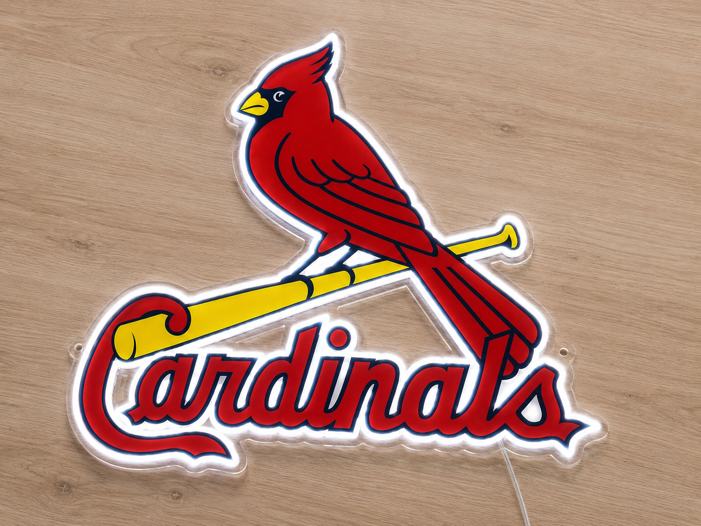 Angled view of St. Louis Cardinals neon sign glowing red and yellow