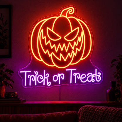 Trick or Treat Pumpkin Neon Sign featuring an orange pumpkin with a jagged grin above purple Trick or Treat lettering, displayed on a dark wall above a wooden sideboard.